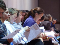 Attendees Look at Convention Program